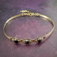 Luxurious gold surrounds large freshwater pearls in an exotic peacock color {blues and greens} in this submissive locking BDSM collar. It's bold, yet delicate and oh so feminine. Show your ownership or submission with beauty and grace.