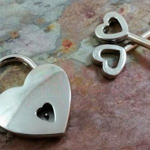A HEART Lock, Small {7/8") from MY SECRET HEART STUDIOS and keys on a table.