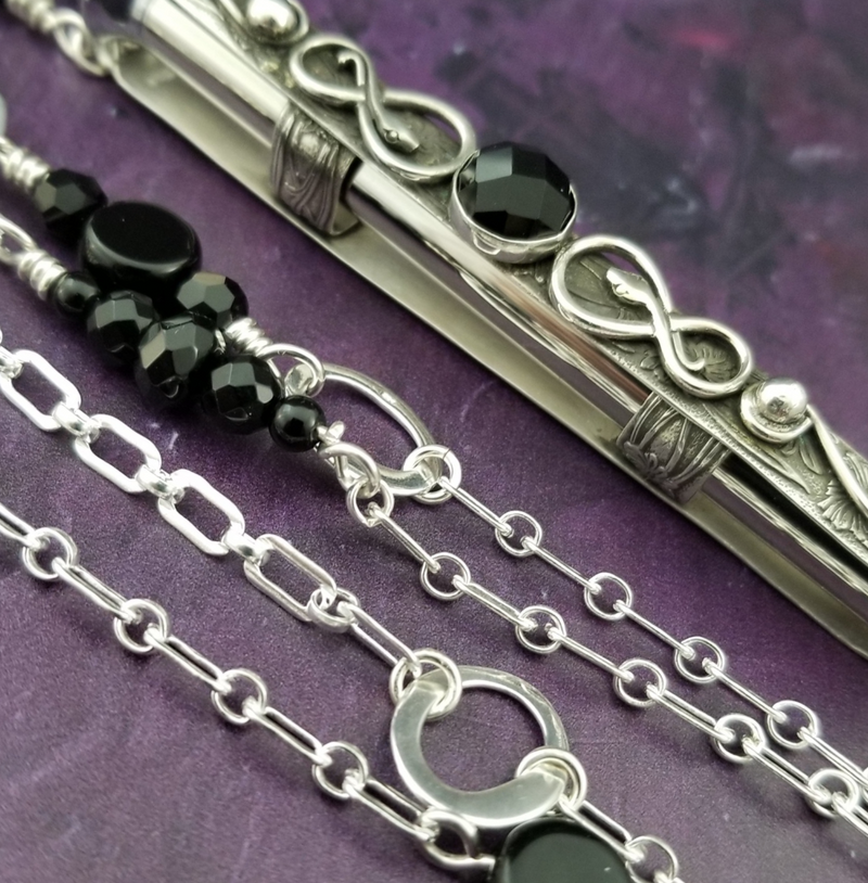 A BDSM gemstone necklace with a kinky secret. It holds a vibe! The ultimate luxury, this dark beauty pays homage to those dark, sensual moods.