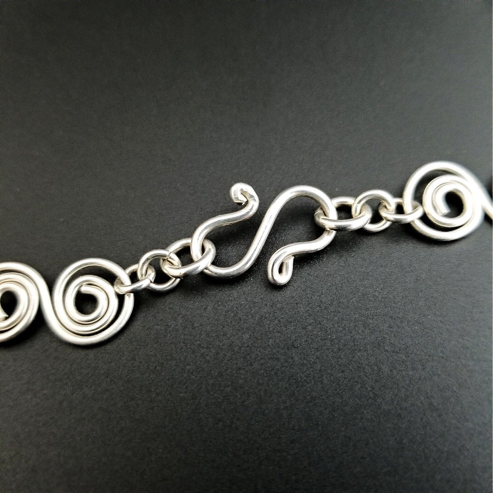 An infinity symbol is a universal statement of unending love. I believe those in a committed BDSM lifestyle know that our commitment is usually deeper and stronger than most traditional relationships. {Just my humble opinion, ;-D } These soft chain link collar is such a beautiful way to honor your power exchange or dynamic. This submissive collar can be worn locked, or with a traditional clasp for total discretion.