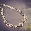 These BDSM Soft Locking Infinity Collars are such a beautiful way to show and honor your D/s or M/s dynamic.  Featuring handcrafted Infinity links made of precious metals and embellished with gemstones. This submissive collar can be worn locked, or with a traditional clasp for total discretion.