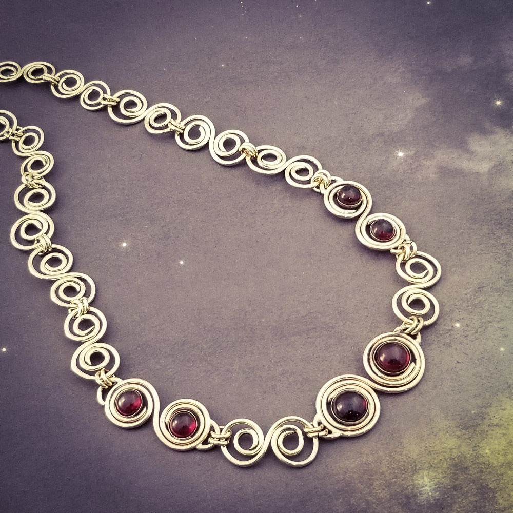 These BDSM Soft Locking Infinity Collars are such a beautiful way to show and honor your D/s or M/s dynamic.  Featuring handcrafted Infinity links made of precious metals and embellished with gemstones. This submissive collar can be worn locked, or with a traditional clasp for total discretion.