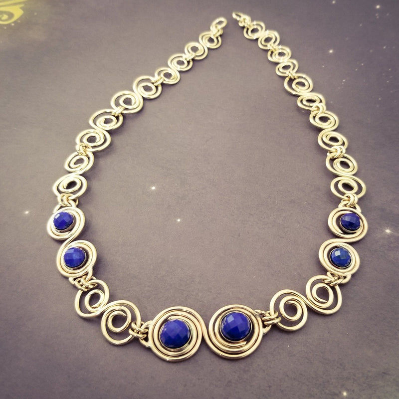 These BDSM Soft Locking Infinity Collars are such a beautiful way to show and honor your D/s or M/s dynamic.  Featuring handcrafted Infinity links made of precious metals and embellished with gemstones. This submissive collar can be worn locked, or with a traditional clasp for total discretion.