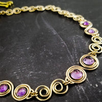 These BDSM Soft Locking Infinity Collars are such a beautiful way to show and honor your D/s or M/s dynamic.  Featuring handcrafted Infinity links made of precious metals and embellished with gemstones. This submissive collar can be worn locked, or with a traditional clasp for total discretion.