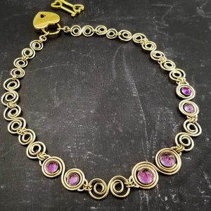 These BDSM Soft Locking Infinity Collars are such a beautiful way to show and honor your D/s or M/s dynamic.  Featuring handcrafted Infinity links made of precious metals and embellished with gemstones. This submissive collar can be worn locked, or with a traditional clasp for total discretion.