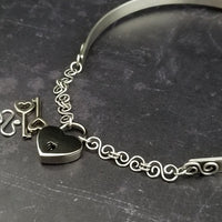 A submissive collar so unique, you'll be proud to wear this collar anywhere! It certainly doesn't 'look' like a BDSM locking collar. You'll treasure this piece! The solid sterling silver collar features White Moonstone cabochons and hand crafted Infinity symbols.