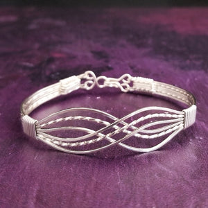 Symbolizes enduring love and commitment. Handcrafted in strands of both smooth and hand twisted precious metals. The bracelet can be locked for a beautifully discreet symbol of submission or ownership, or it can be created as a traditional bracelet.