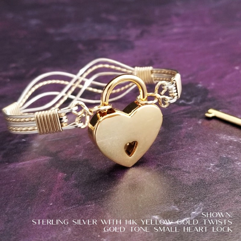 Symbolizes enduring love and commitment. Handcrafted in strands of both smooth and hand twisted precious metals. The bracelet can be locked for a beautifully discreet symbol of submission or ownership, or it can be created as a traditional bracelet.