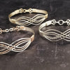 Symbolizes enduring love and commitment. Handcrafted in strands of both smooth and hand twisted precious metals. The bracelet can be locked for a beautifully discreet symbol of submission or ownership, or it can be created as a traditional bracelet.