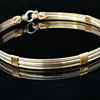 The JANUS collection of artisan BDSM jewelry is reminiscent of ancient Rome. The Janus Submissive Collar is a locking collar made of gleaming sterling silver with 14k gold filled accents
