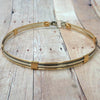 The JANUS collection of artisan BDSM jewelry is reminiscent of ancient Rome. The Janus Submissive Collar is a locking collar made of gleaming sterling silver with 14k gold filled accents
