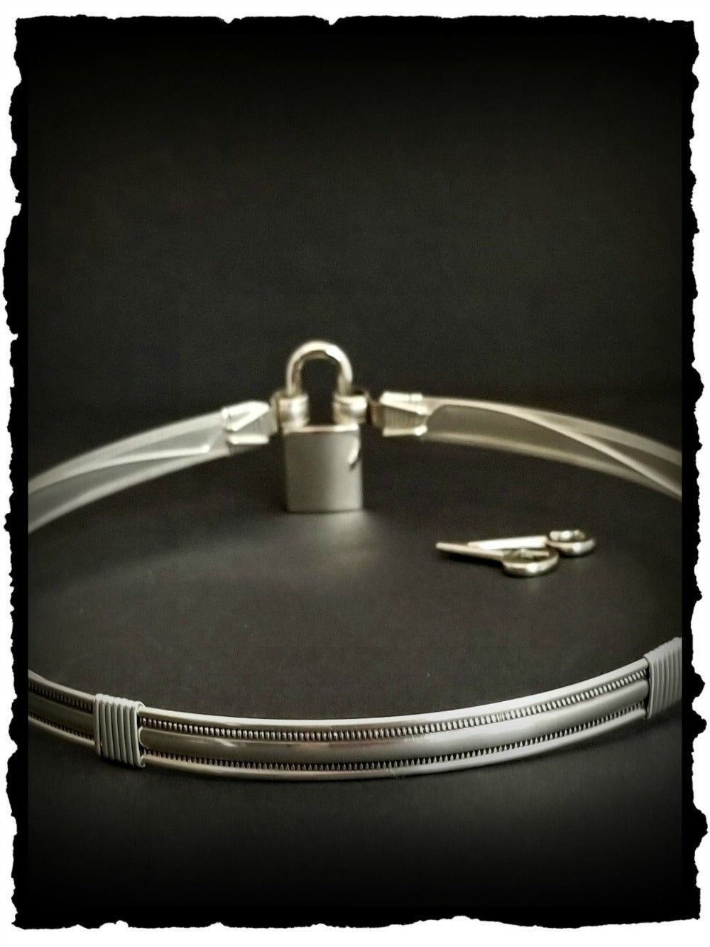 The Janus Submissive Collar is a locking collar made of luscious Sterling Silver, so it's a statement of ownership, yet discreet enough to wear in the vanilla world.
