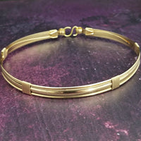 The Janus Submissive Collar is a locking collar made of luscious sterling silver with gleaming gold filled accents, so it's a statement of ownership, yet discreet enough to wear in the vanilla world. 