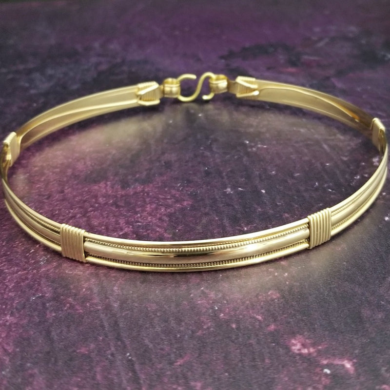 The Janus Submissive Collar is a locking collar made of luscious sterling silver with gleaming gold filled accents, so it's a statement of ownership, yet discreet enough to wear in the vanilla world. 