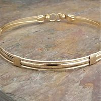 The Janus Submissive Collar is a locking collar made of luscious sterling silver with gleaming gold filled accents, so it's a statement of ownership, yet discreet enough to wear in the vanilla world. 