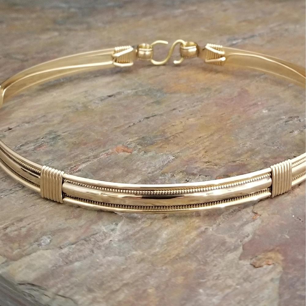 The Janus Submissive Collar is a locking collar made of luscious sterling silver with gleaming gold filled accents, so it's a statement of ownership, yet discreet enough to wear in the vanilla world. 