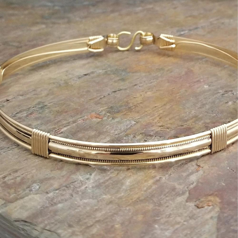 The Janus Submissive Collar is a locking collar made of luscious sterling silver with gleaming gold filled accents, so it's a statement of ownership, yet discreet enough to wear in the vanilla world. 