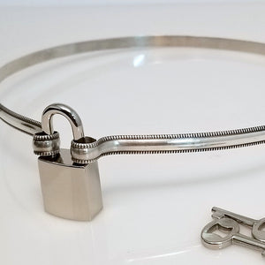The Janus Submissive Collar is a locking collar made of luscious Sterling Silver, so it's a statement of ownership, yet discreet enough to wear in the vanilla world.
