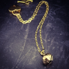 A submissive kitten bell handcrafted crafted with all the grace and discretion that My Secret Heart is known for. This artisan bell is hand sawn from a 14k yellow gold filled sheet, then torched, hammered and domed into an exquisite bell. Filled with stainless steel pellets for a delicate jingle.