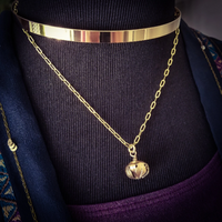 A submissive kitten bell handcrafted crafted with all the grace and discretion that My Secret Heart is known for. This artisan bell is hand sawn from a 14k yellow gold filled sheet, then torched, hammered and domed into an exquisite bell. Filled with stainless steel pellets for a delicate jingle.