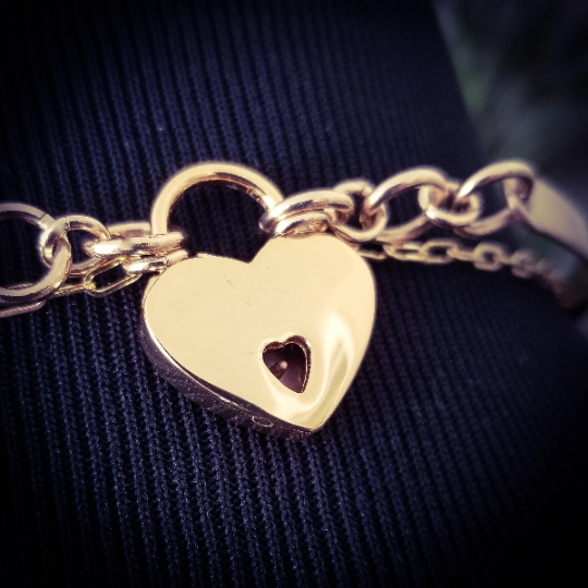 A submissive kitten bell handcrafted crafted with all the grace and discretion that My Secret Heart is known for. This artisan bell is hand sawn from a 14k yellow gold filled sheet, then torched, hammered and domed into an exquisite bell. Filled with stainless steel pellets for a delicate jingle.