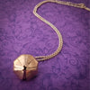 A locking submissive kitten bell collar, handcrafted crafted with all the grace and discretion that My Secret Heart is known for. This artisan bell is hand sawn from rose gold sheet, hammered and domed into an exquisite bell. Filled with stainless steel pellets for a delicate jingle.