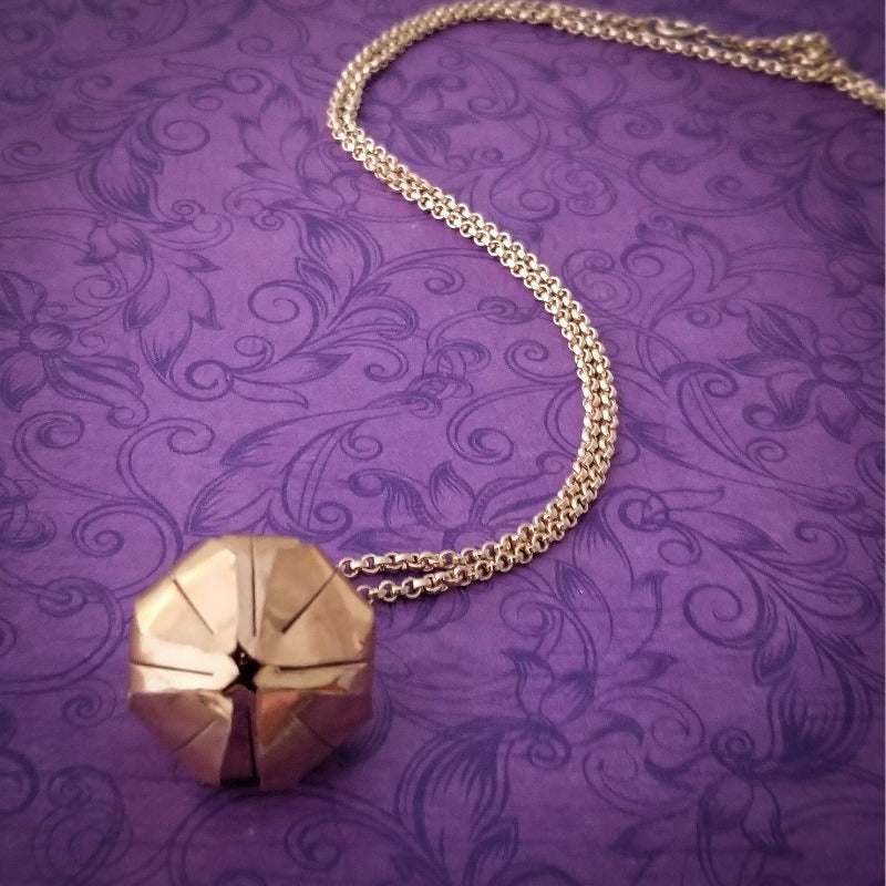 A locking submissive kitten bell collar, handcrafted crafted with all the grace and discretion that My Secret Heart is known for. This artisan bell is hand sawn from rose gold sheet, hammered and domed into an exquisite bell. Filled with stainless steel pellets for a delicate jingle.