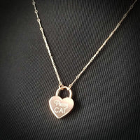 Sweet, yet a solid statement of ownership. A delicate BDSM submissive chain collar with engraved lock. Purr-fect for kittens.