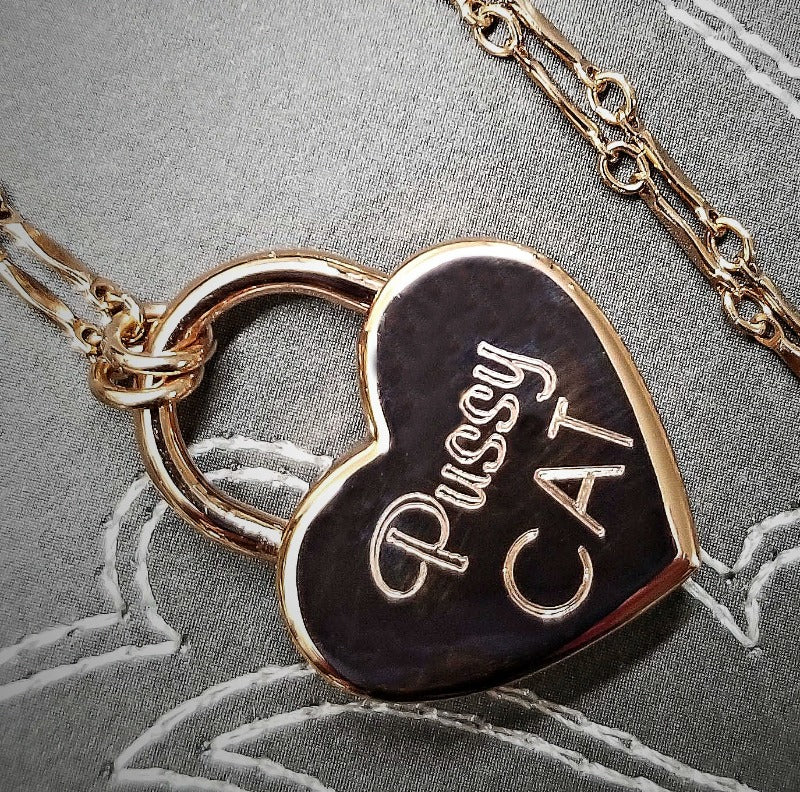 Sweet, yet a solid statement of ownership. A delicate BDSM submissive chain collar with engraved lock. Purr-fect for kittens.