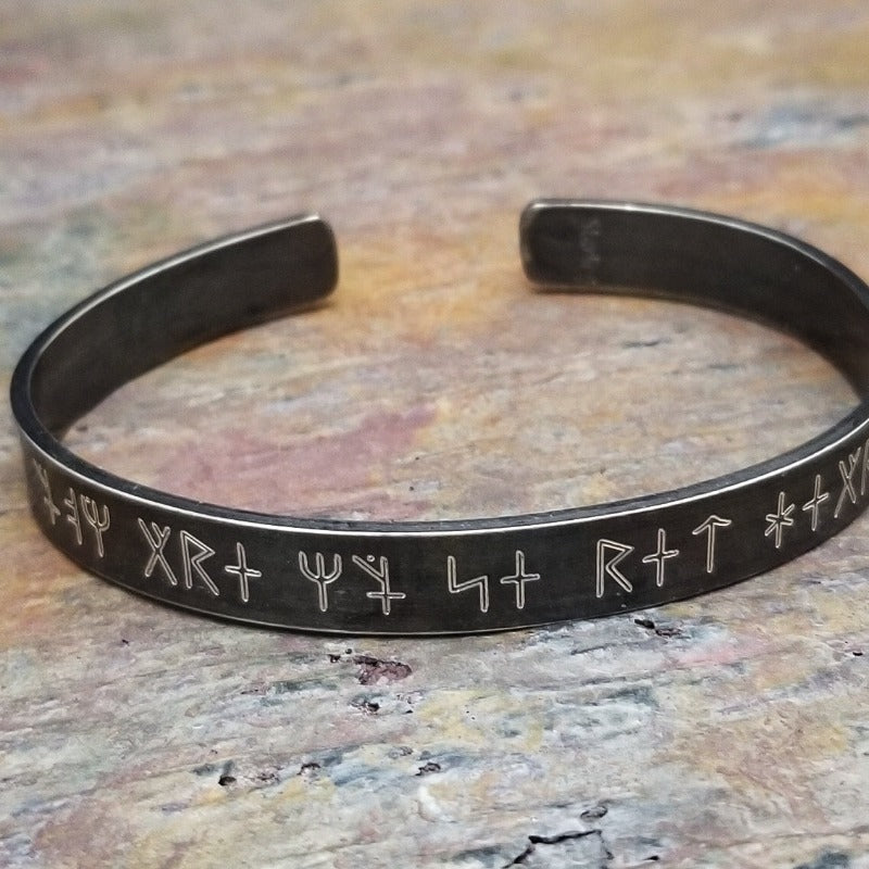 Share a secret. Ancient looking fonts create unique cuffs with a secret message. The outside inscription is Kanji symbols. Traditional Cuff with gap. All Sterling Silver, heavily oxidized. Message: You Are My Secret Heart