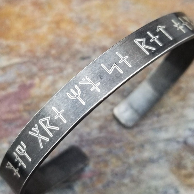 Share a secret. Ancient looking fonts create unique cuffs with a secret message. The outside inscription is Kanji symbols. Traditional Cuff with gap. All Sterling Silver, heavily oxidized. Message: You Are My Secret Heart