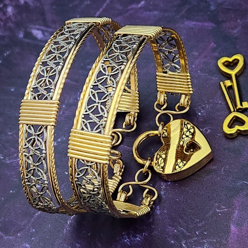 Dekka's BDSM Submissive Handcuff Bracelets or Anklets feature sterling silver lattice work with delicate precious metal accents for a luxurious, daring look. With its intricate design, these bracelets or anklets communicate Ownership in a stylish, understated way.