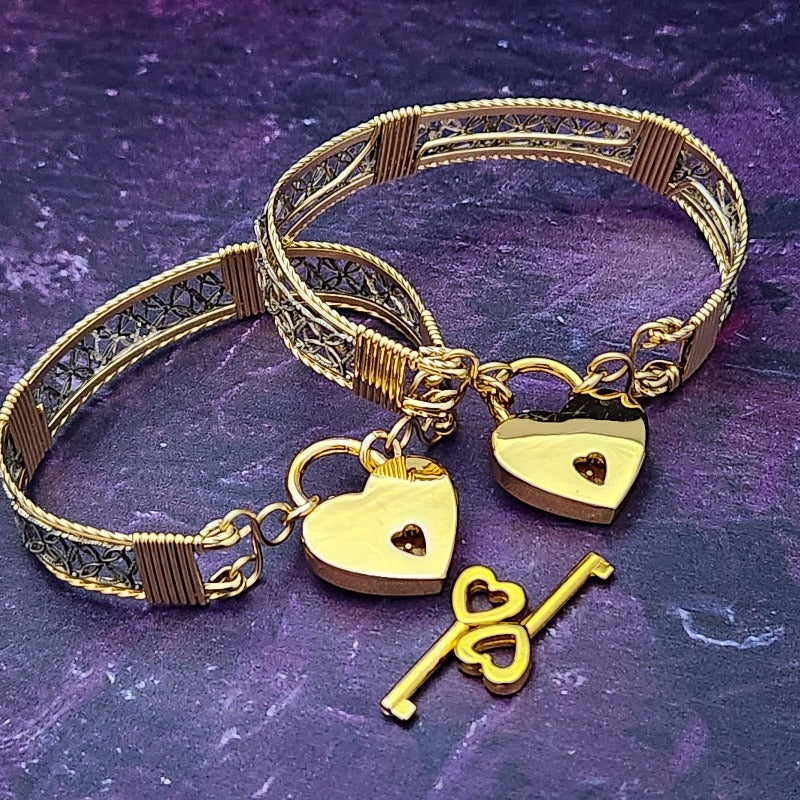 Dekka's BDSM Submissive Handcuff Bracelets or Anklets feature sterling silver lattice work with delicate precious metal accents for a luxurious, daring look. With its intricate design, these bracelets or anklets communicate Ownership in a stylish, understated way.