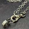 A sleek and simple chain collar of Stainless Steel gets it done. The handle is 10 inches of chain, so both small and large hands should fit easily. The 36 inch chain ends with a silver tone swivel trigger clip. Features a handcrafted sterling O Ring with a bail opening large enough to fit most all of our collars.
