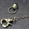 A sleek and simple chain collar of Stainless Steel gets it done. The handle is 10 inches of chain, so both small and large hands should fit easily. The 36 inch chain ends with a silver tone swivel trigger clip. Features a handcrafted sterling O Ring with a bail opening large enough to fit most all of our collars.