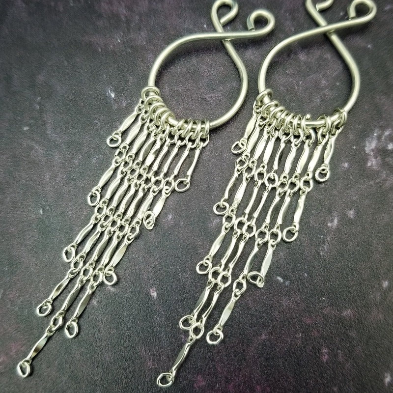 These nipple rings are non-piercing and fully adjustable, so you can achieve a nice snug fit that suits your experience. Place the nipple rings over erect nipples and tighten or loosen to achieve the perfect fit, and a delectable squeeze. These beautiful accessories will keep your nipples proud and standing tall. Wonderful for sensation play. By My Secret Heart Studios
