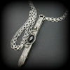An artisan gemstone necklace with a kinky secret!  The sterling silver pendant cages a sleek and sexy vibrator. So discreet, no one will ever guess. Think of all the fun you can have with this wicked little toy! 