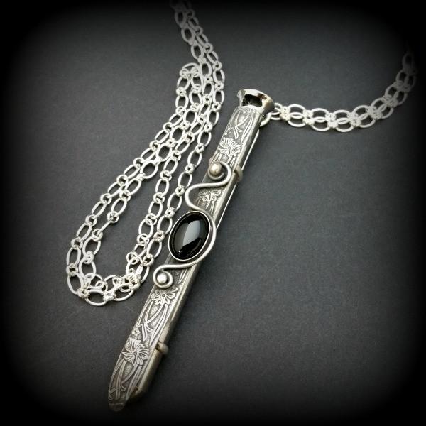 An artisan gemstone necklace with a kinky secret!  The sterling silver pendant cages a sleek and sexy vibrator. So discreet, no one will ever guess. Think of all the fun you can have with this wicked little toy! 