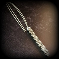 An artisan gemstone necklace with a kinky secret!  The sterling silver pendant cages a sleek and sexy vibrator. So discreet, no one will ever guess. Think of all the fun you can have with this wicked little toy!