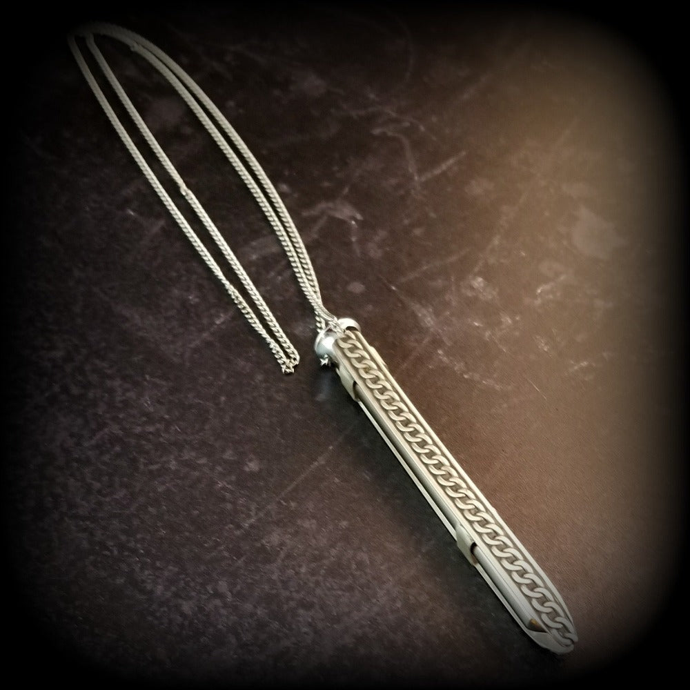 An artisan gemstone necklace with a kinky secret!  The sterling silver pendant cages a sleek and sexy vibrator. So discreet, no one will ever guess. Think of all the fun you can have with this wicked little toy!