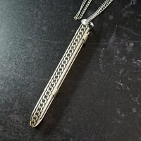 An artisan gemstone necklace with a kinky secret!  The sterling silver pendant cages a sleek and sexy vibrator. So discreet, no one will ever guess. Think of all the fun you can have with this wicked little toy!