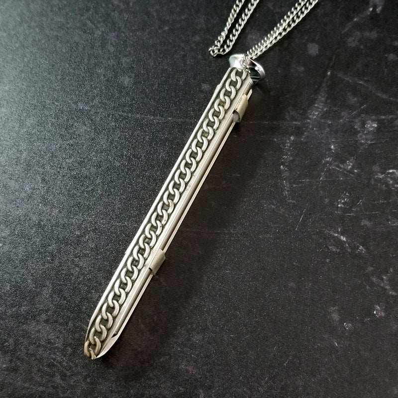 An artisan gemstone necklace with a kinky secret!  The sterling silver pendant cages a sleek and sexy vibrator. So discreet, no one will ever guess. Think of all the fun you can have with this wicked little toy!