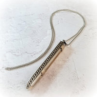 An artisan gemstone necklace with a kinky secret!  The sterling silver pendant cages a sleek and sexy vibrator. So discreet, no one will ever guess. Think of all the fun you can have with this wicked little toy!
