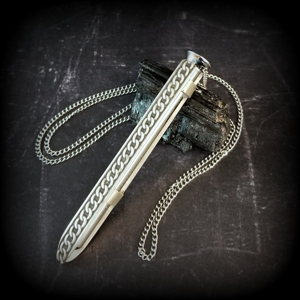 An artisan gemstone necklace with a kinky secret!  The sterling silver pendant cages a sleek and sexy vibrator. So discreet, no one will ever guess. Think of all the fun you can have with this wicked little toy!
