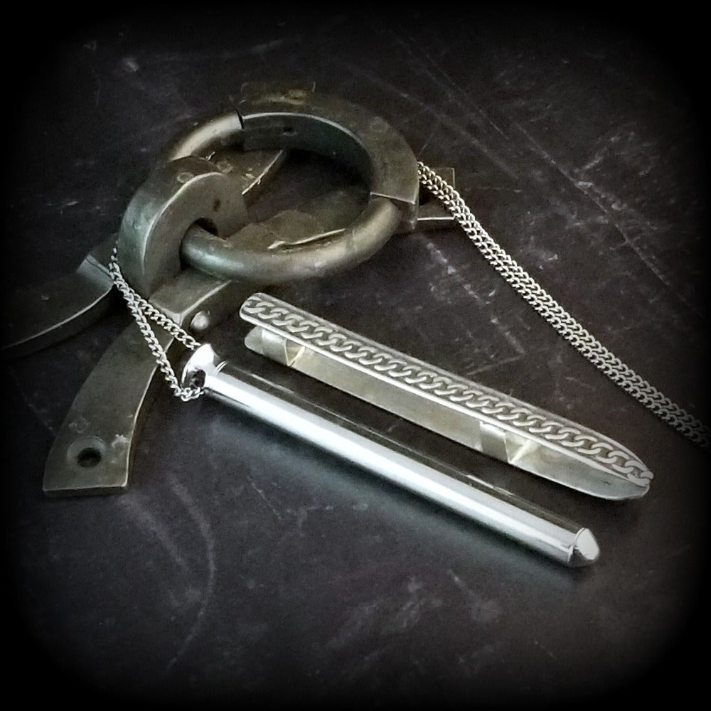 An artisan gemstone necklace with a kinky secret!  The sterling silver pendant cages a sleek and sexy vibrator. So discreet, no one will ever guess. Think of all the fun you can have with this wicked little toy!