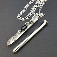 An artisan gemstone necklace with a kinky secret!  The sterling silver pendant cages a sleek and sexy vibrator. So discreet, no one will ever guess. Think of all the fun you can have with this wicked little toy! 