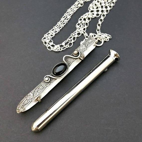 An artisan gemstone necklace with a kinky secret!  The sterling silver pendant cages a sleek and sexy vibrator. So discreet, no one will ever guess. Think of all the fun you can have with this wicked little toy! 