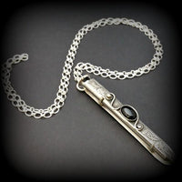 An artisan gemstone necklace with a kinky secret!  The sterling silver pendant cages a sleek and sexy vibrator. So discreet, no one will ever guess. Think of all the fun you can have with this wicked little toy! 