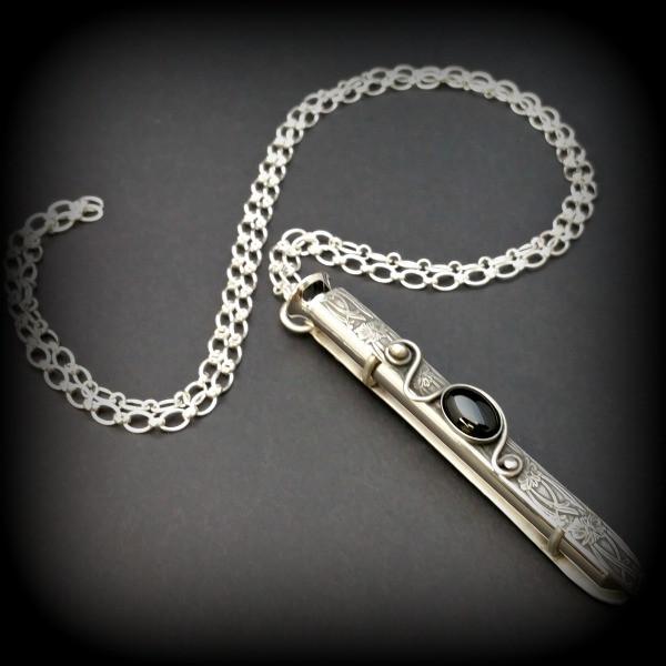 An artisan gemstone necklace with a kinky secret!  The sterling silver pendant cages a sleek and sexy vibrator. So discreet, no one will ever guess. Think of all the fun you can have with this wicked little toy! 