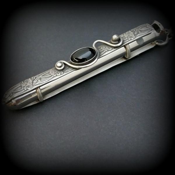 An artisan gemstone necklace with a kinky secret!  The sterling silver pendant cages a sleek and sexy vibrator. So discreet, no one will ever guess. Think of all the fun you can have with this wicked little toy! 